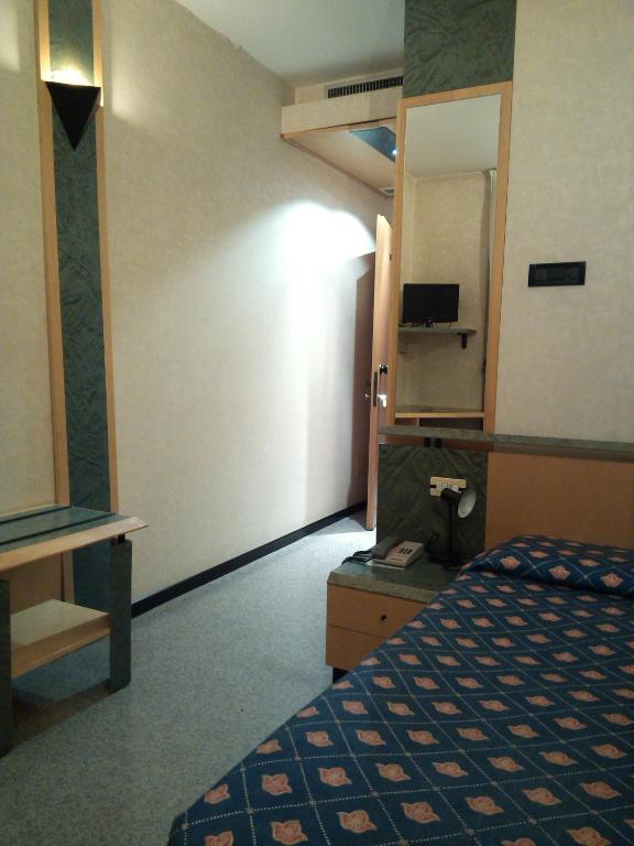 Postel nebo postele na pokoji v ubytování Hotel Palladio