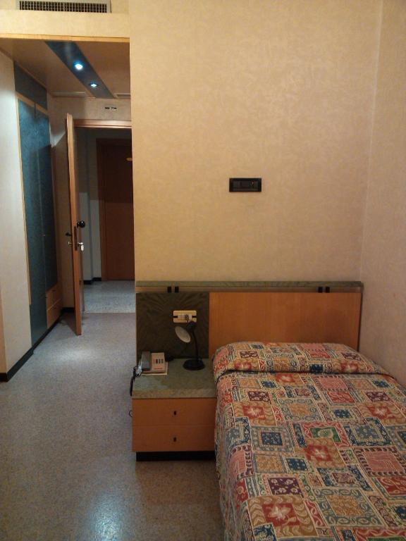 Postel nebo postele na pokoji v ubytování Hotel Palladio
