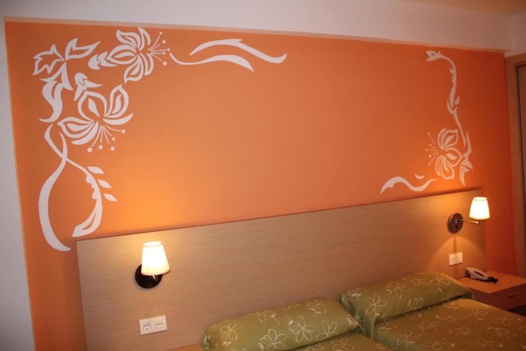 Postel nebo postele na pokoji v ubytování Hotel Golden