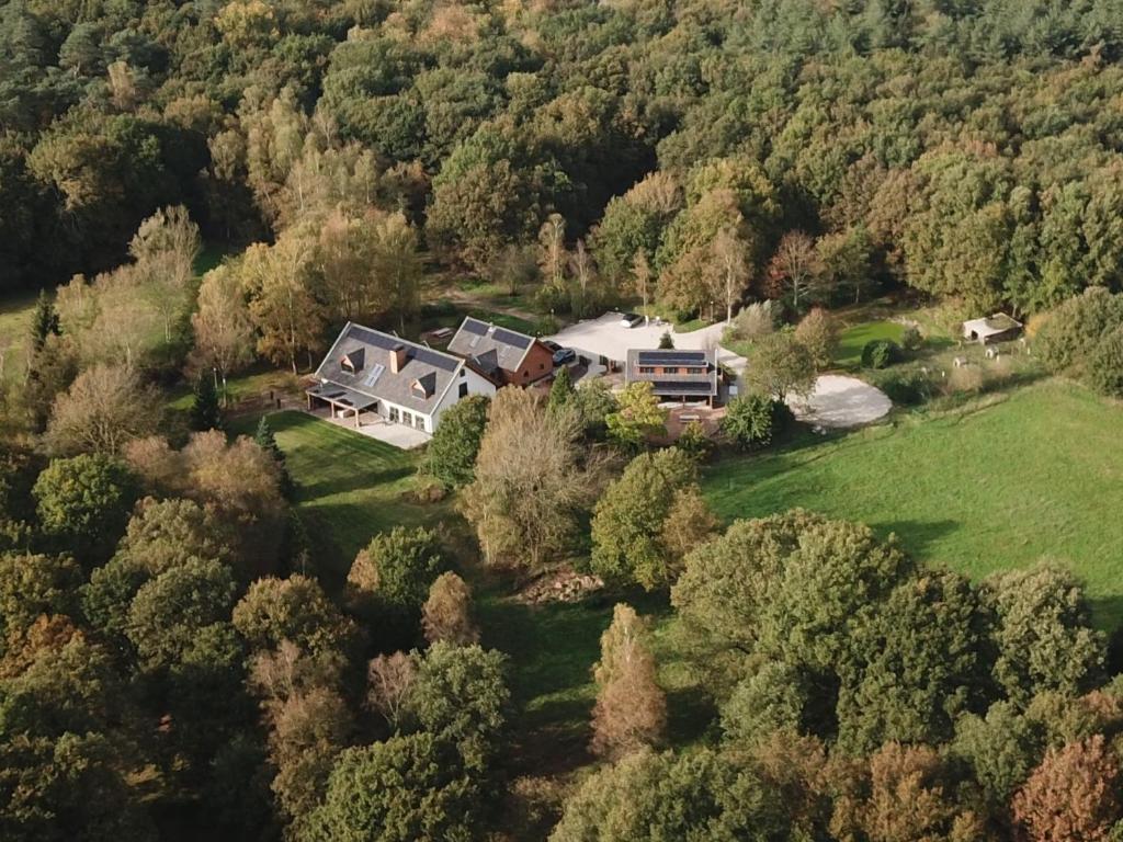 an aerial view of a house in the woods at Inn The Woods - Private Stay in Overberg