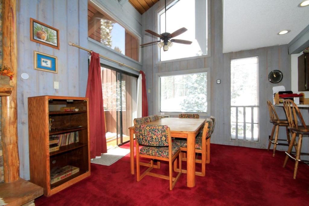 a dining room with a table and some chairs at Mammoth Ski & Racquet Club #074 in Mammoth Lakes