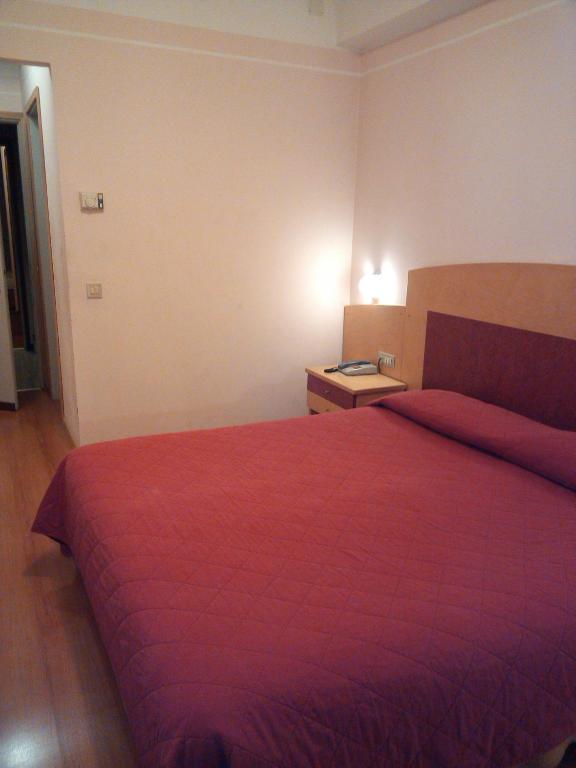 Postel nebo postele na pokoji v ubytování Hotel Palladio