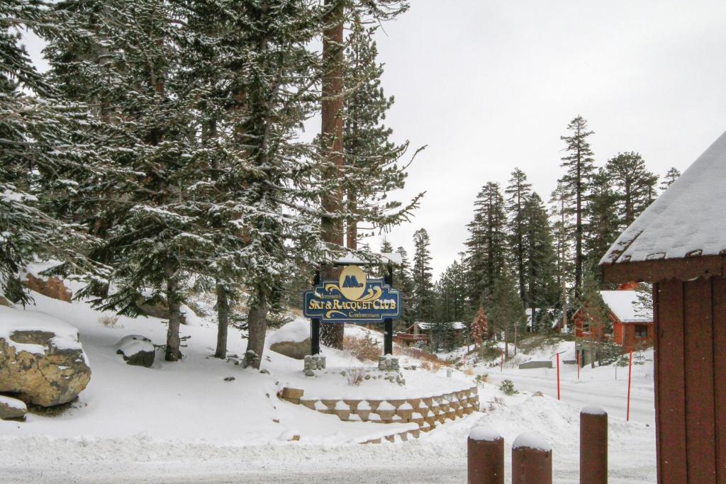 a sign for a ski resort in the snow at Mammoth Ski & Racquet Club #34 in Mammoth Lakes