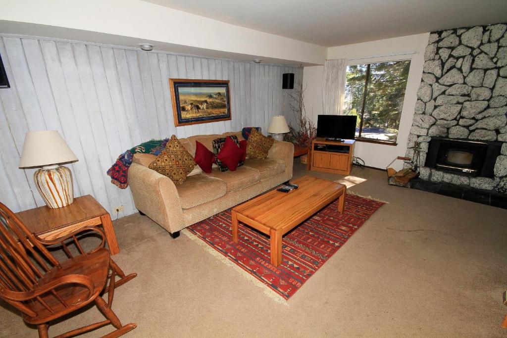 a living room with a couch and a table at Discovery 4 #135 in Mammoth Lakes