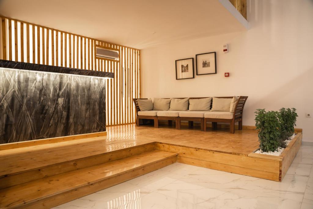 a living room with a couch and a table at HOTEL_TIER in Athens