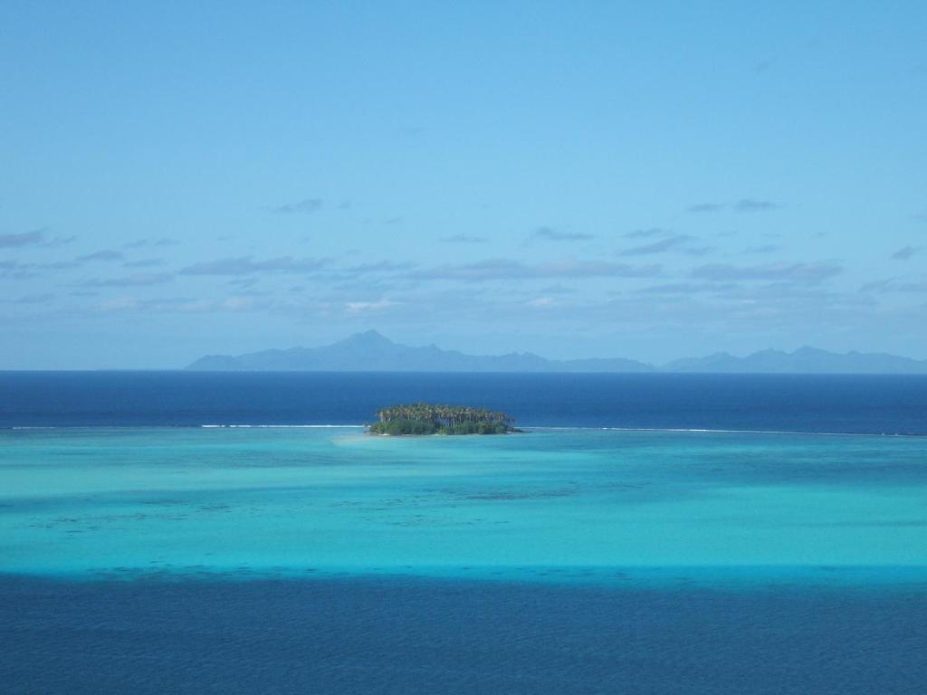 a small island in the middle of the ocean at Hôtel Atiapiti in Opoa