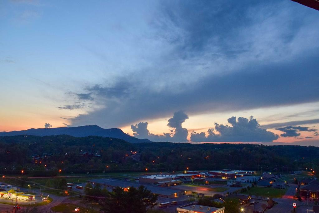 a view of a city with a cloudy sky at sunset at Pigeon Forge Condo Less Than 2 Mi to Attractions! in Pigeon Forge
