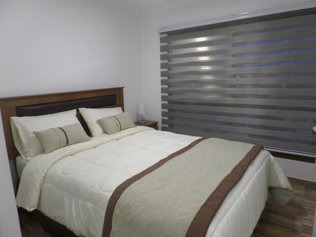 Postel nebo postele na pokoji v ubytování Carolina Hostal