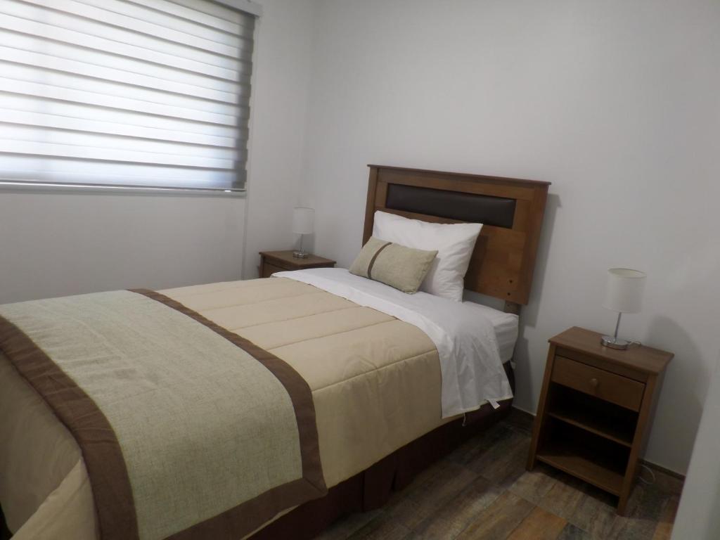 Postel nebo postele na pokoji v ubytování Carolina Hostal