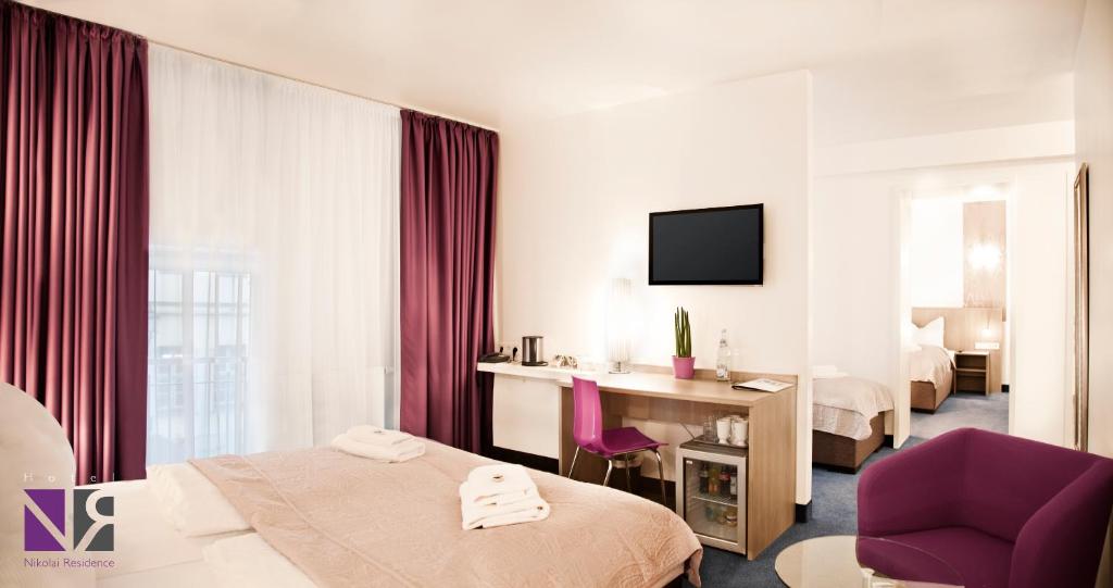 TV o dispositivi per l'intrattenimento presso Hotel Nikolai Residence