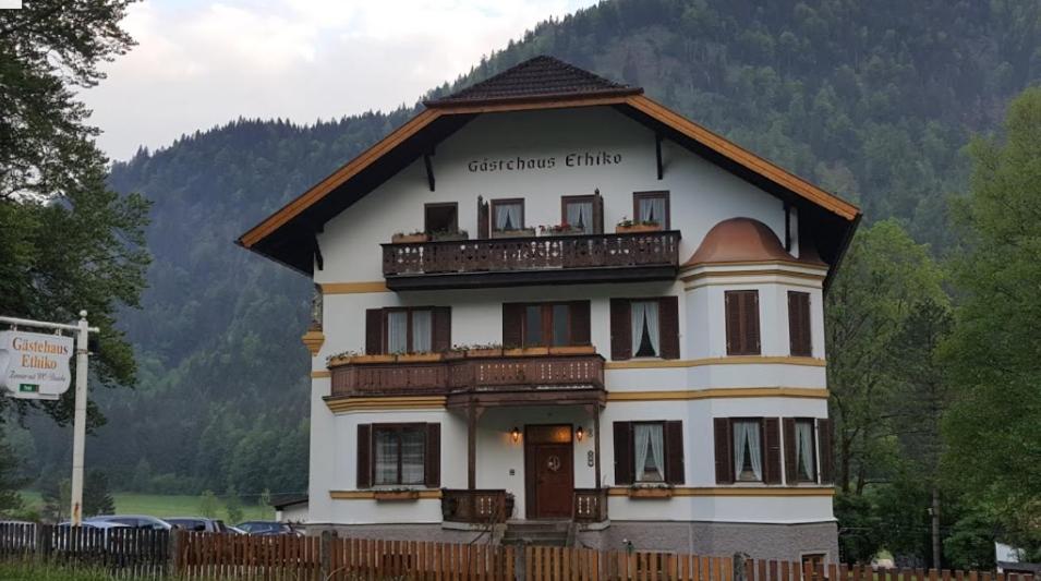 a large white building with a balcony at Gästehaus Ethiko in Ettal