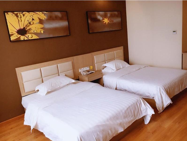 En eller flere senger på et rom på 7Days Inn Yancheng Jianhu Xiu Fu South Road