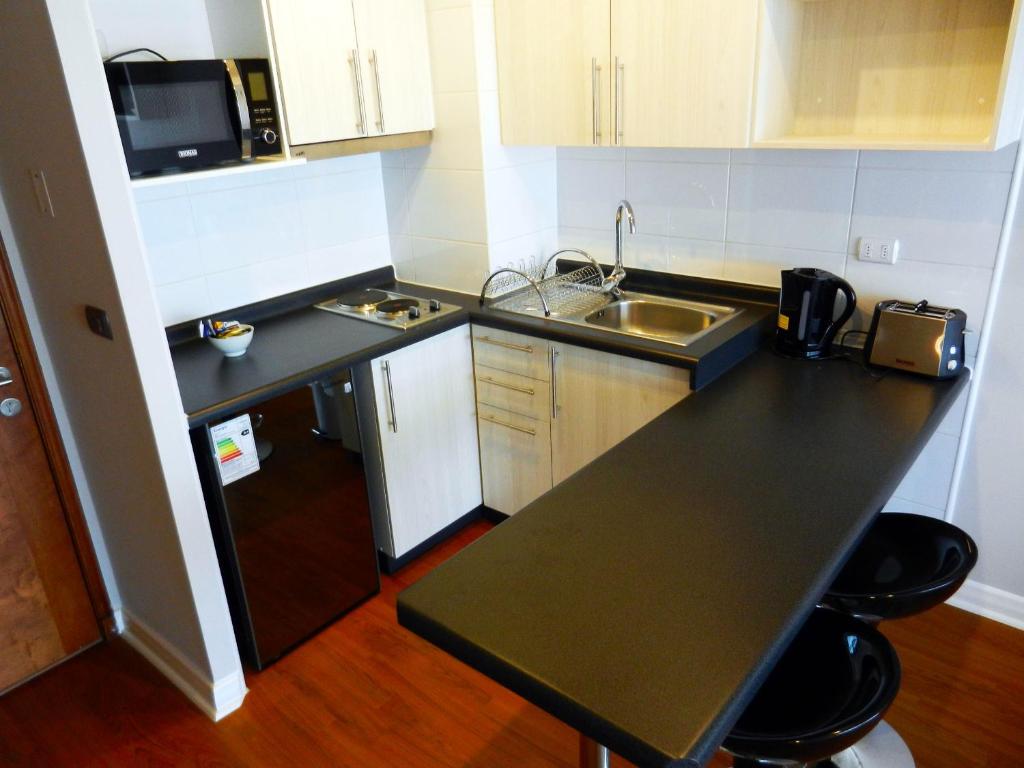 Kuchyň nebo kuchyňský kout v ubytování Apartamentos Terrazas de Talca