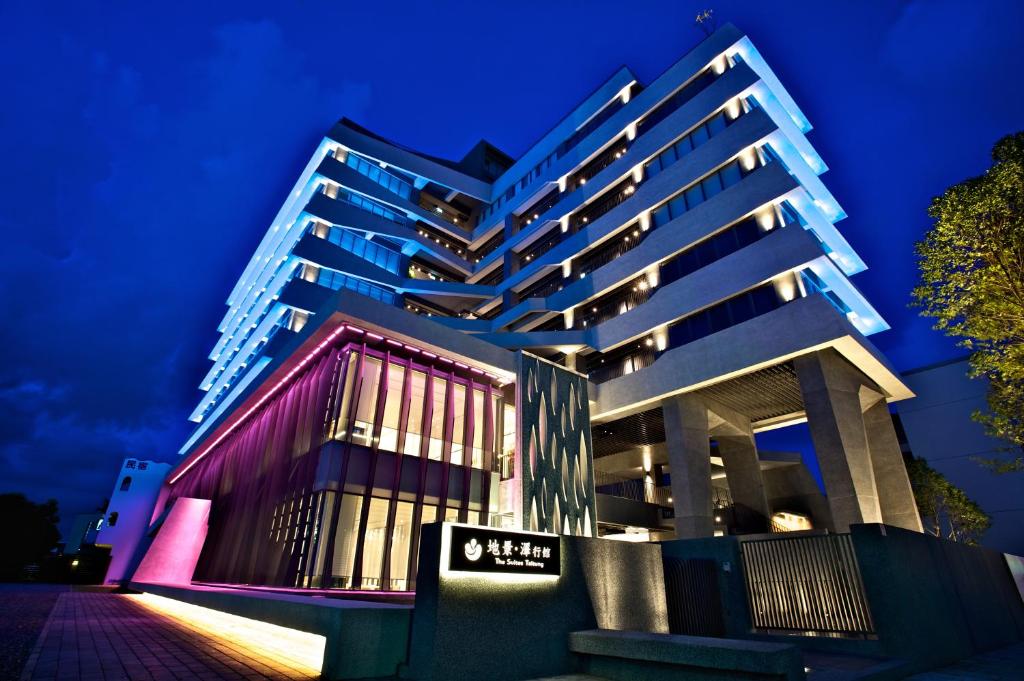 a tall building at night with its lights on at The Suites Taitung in Taitung City