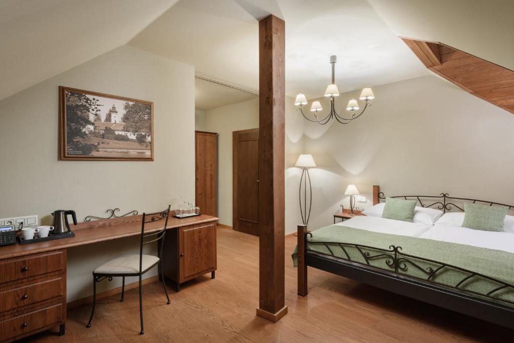 Postel nebo postele na pokoji v ubytování Resort Sobotín