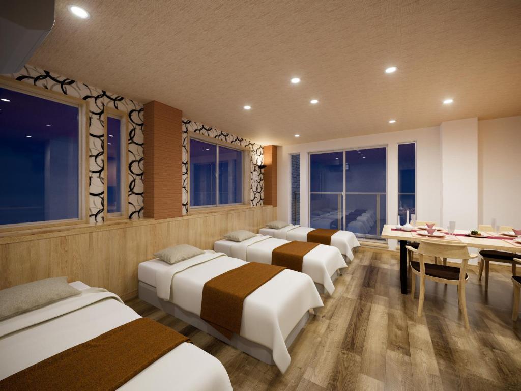 Postel nebo postele na pokoji v ubytování WIRES HOTEL James zaka