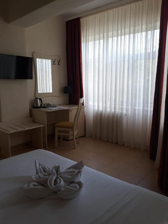 Postel nebo postele na pokoji v ubytování Hotel Florentina