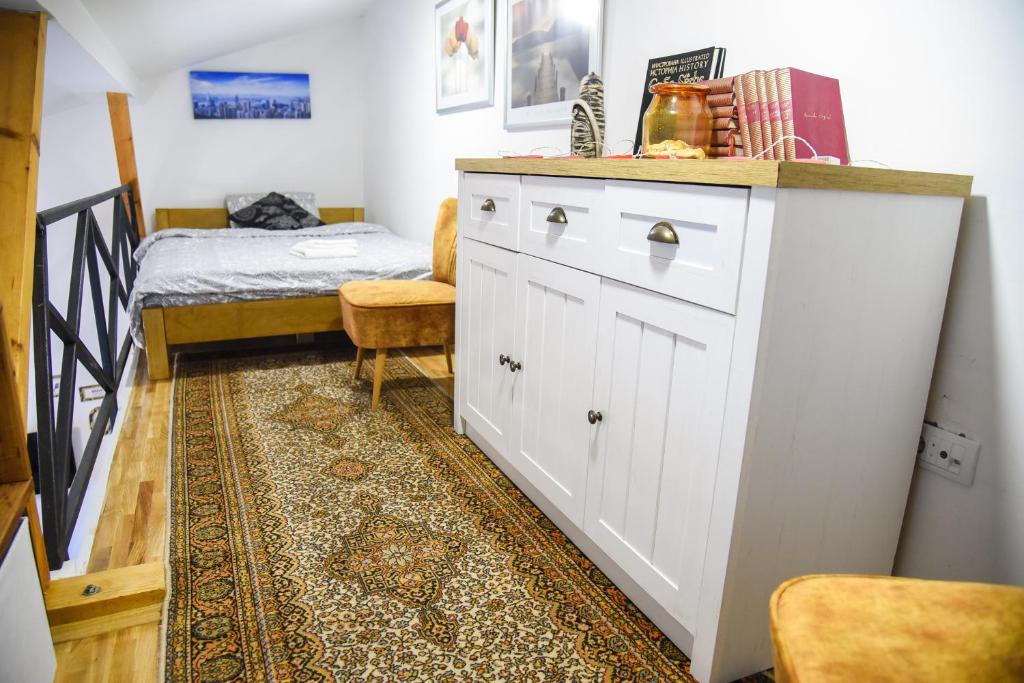 Кровать или кровати в номере Agape Apartman
