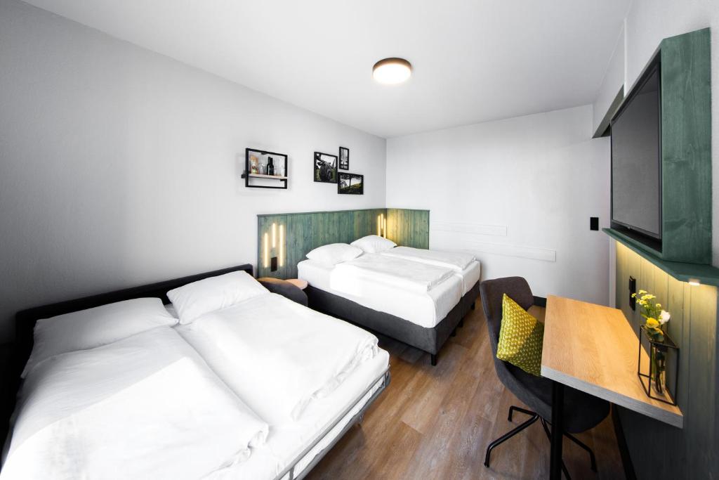 Postel nebo postele na pokoji v ubytování fjord hotel berlin