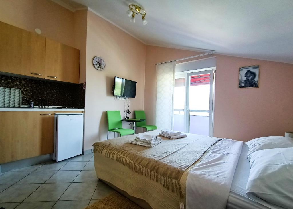Postel nebo postele na pokoji v ubytování ApartHotel Viola