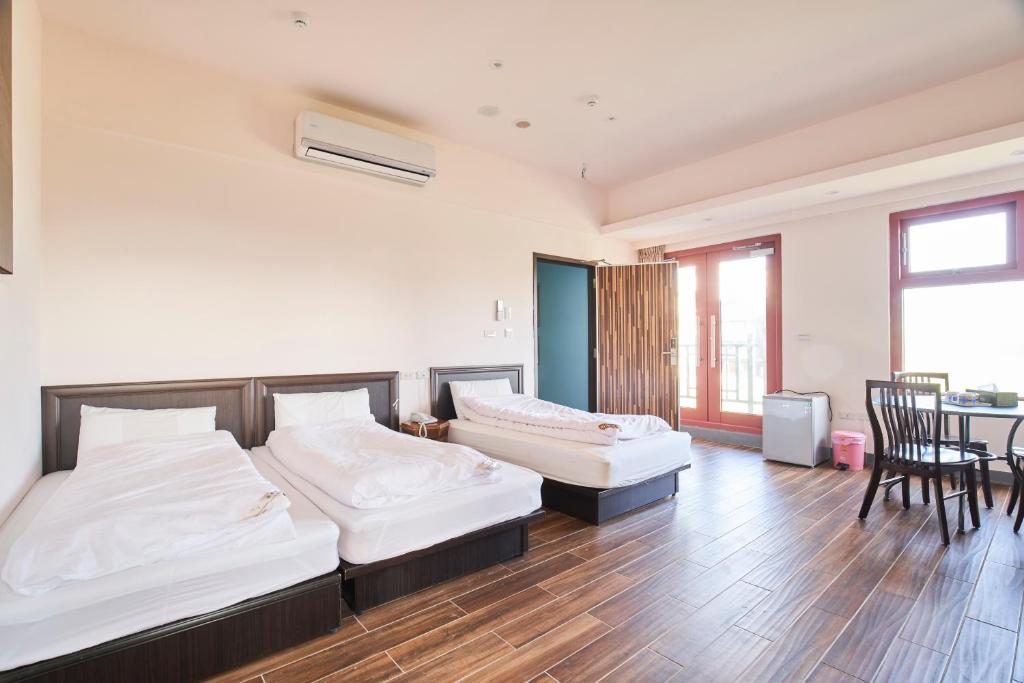 Postel nebo postele na pokoji v ubytování First Shanhai Hotel