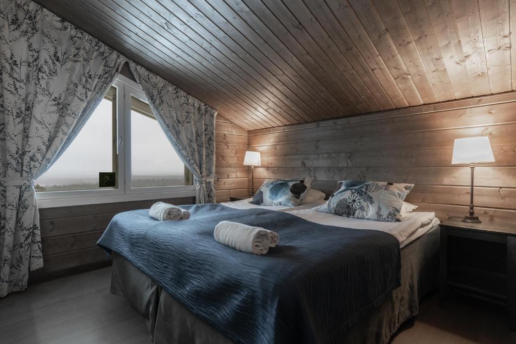 Postel nebo postele na pokoji v ubytování Ski-Inn PyhäLinna