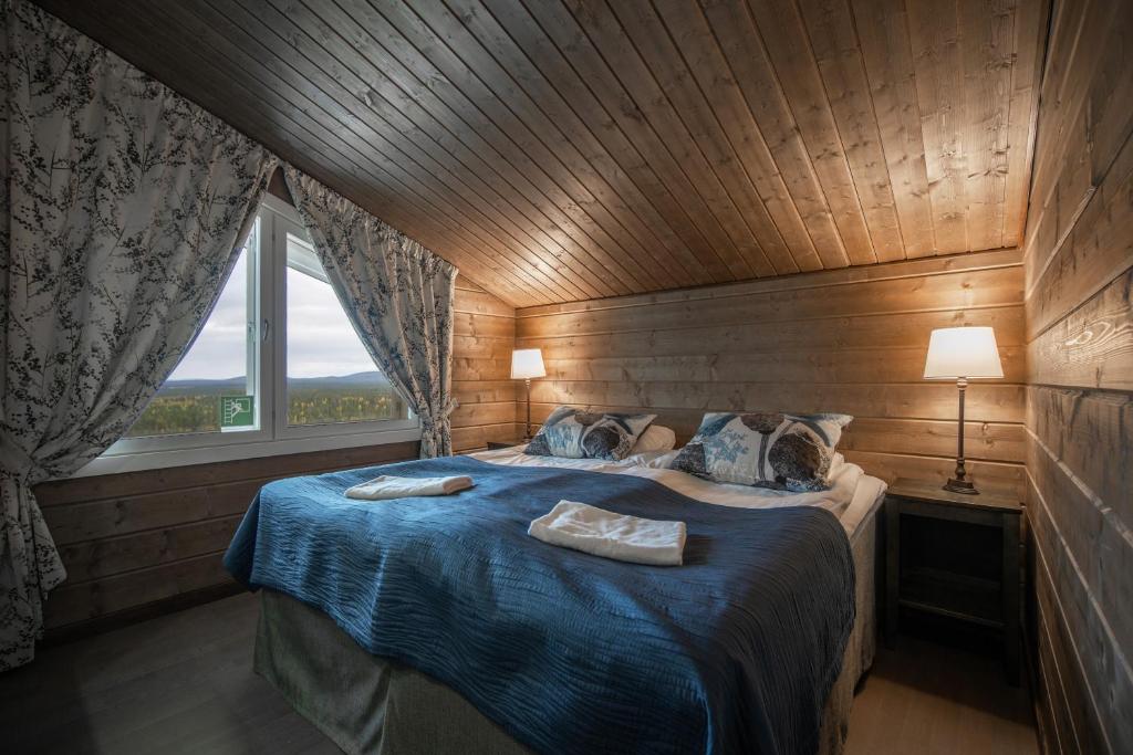 Postel nebo postele na pokoji v ubytování Ski-Inn PyhäLinna