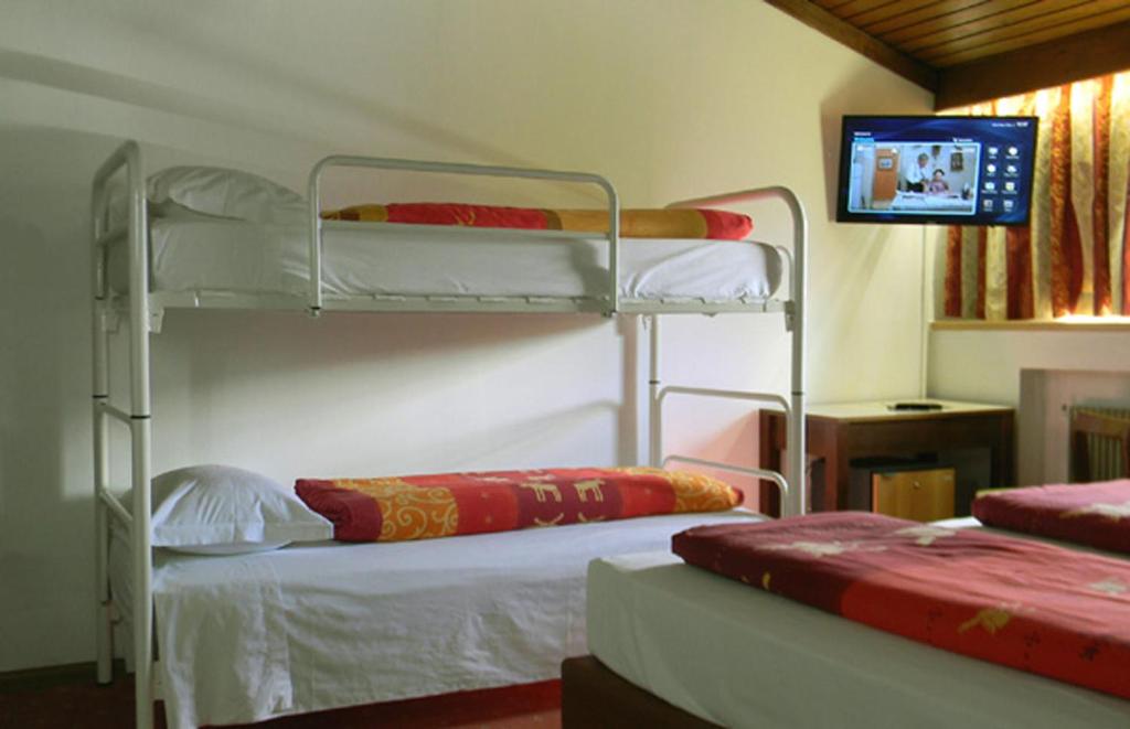 Postel nebo postele na pokoji v ubytování Hotel Bologna
