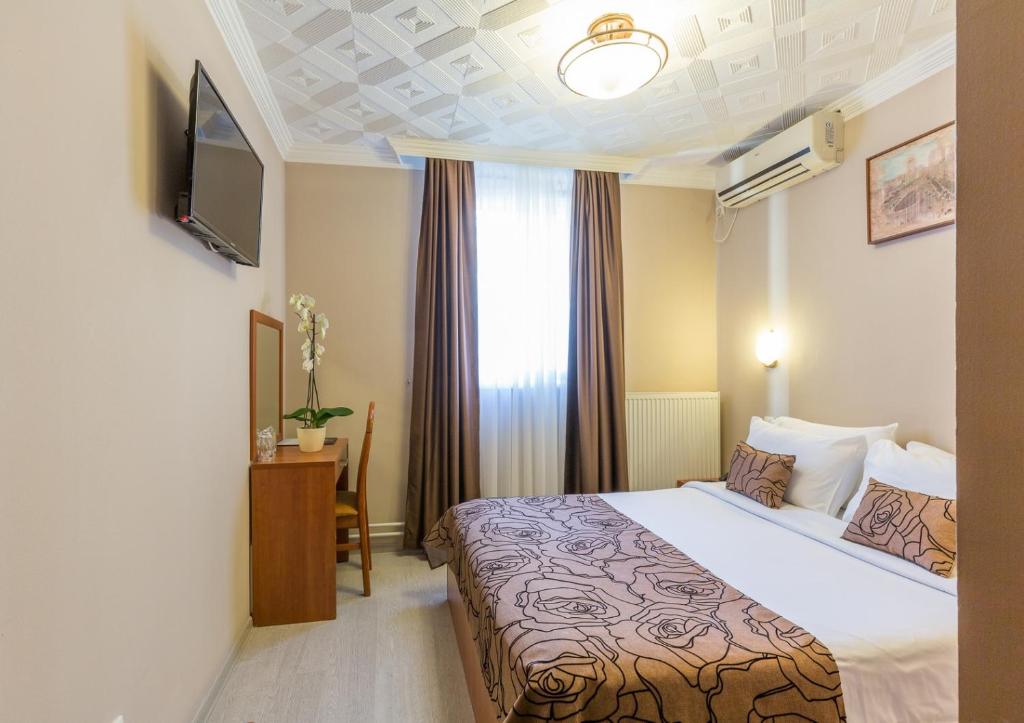 Postel nebo postele na pokoji v ubytování Belgrade City Hotel