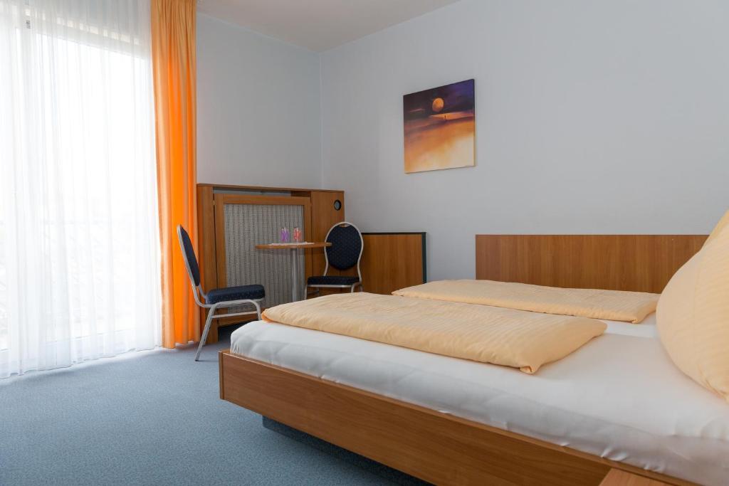 מיטה או מיטות בחדר ב-Svg Hotel Kalimera