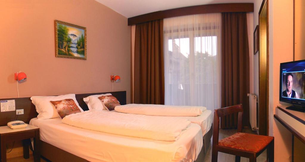 Postel nebo postele na pokoji v ubytování Hotel Bologna