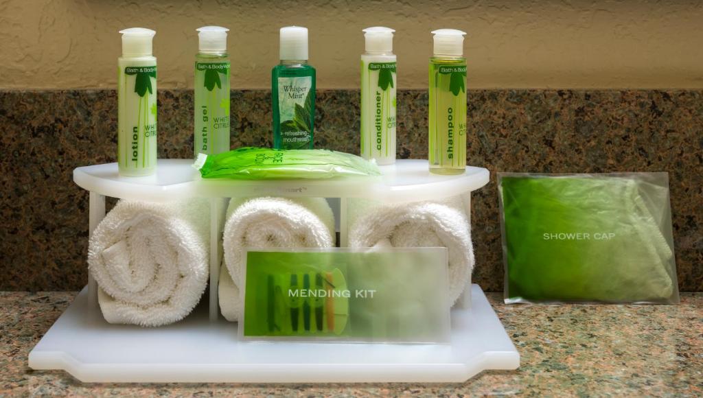 a display of toothbrushes and towels on a shelf at Holiday Inn Express Hotel & Suites Texarkana East by IHG in Texarkana