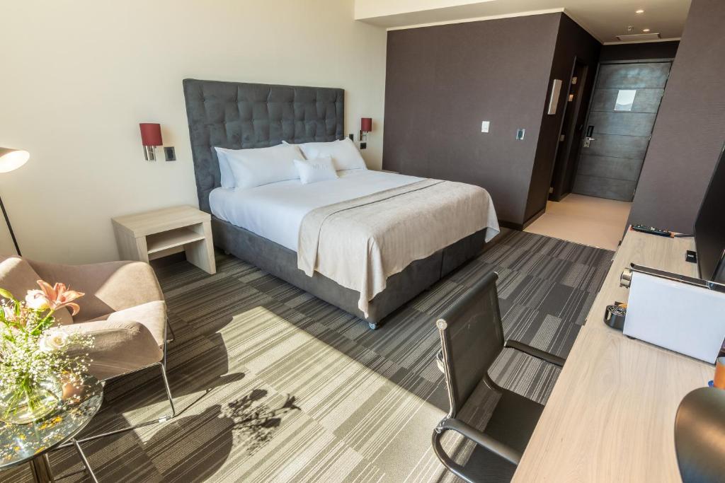Postel nebo postele na pokoji v ubytování MDS Hotel Chillan