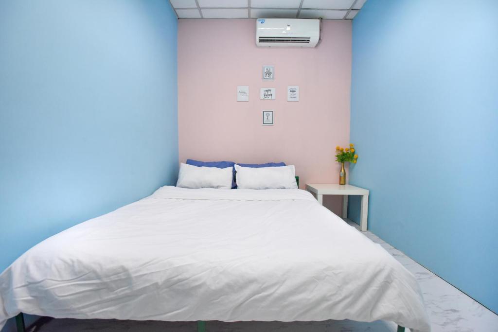 Postel nebo postele na pokoji v ubytování G Traveler Accommodation Homes 居旅舍