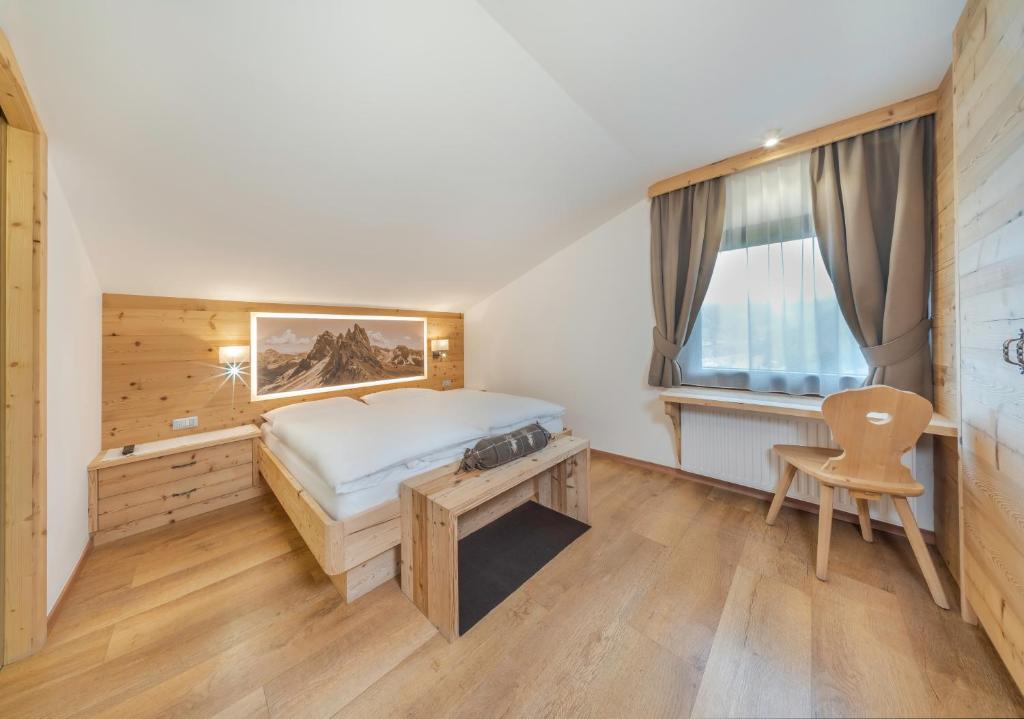 Postel nebo postele na pokoji v ubytování Garni Tramans