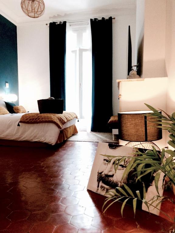 Postel nebo postele na pokoji v ubytování La Domitia - Maison d'hôtes, massages & bien-être