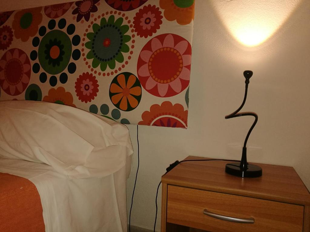 Postel nebo postele na pokoji v ubytování Corte Del Borgo Antico