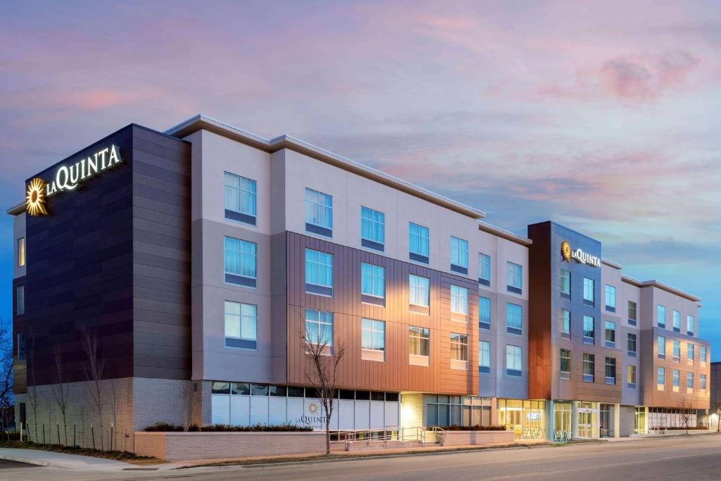 a rendering of the front of a building at La Quinta Inn & Suites by Wyndham Kansas City Beacon Hill in Kansas City