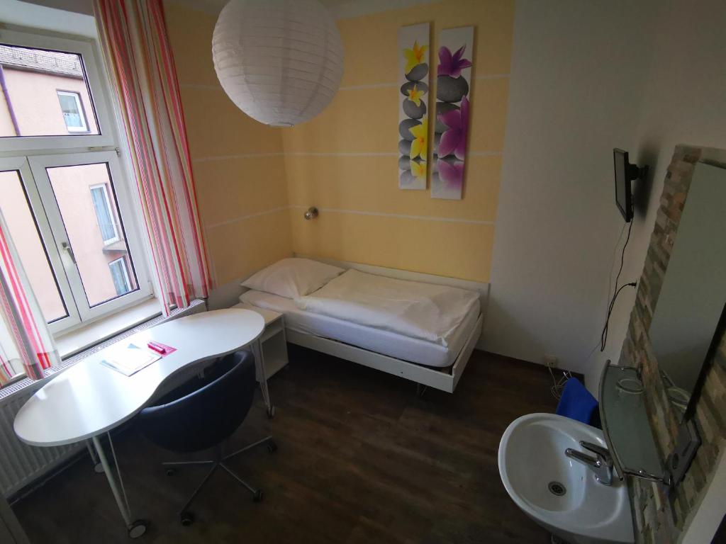 Postel nebo postele na pokoji v ubytování City Hostel
