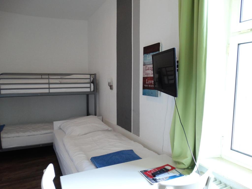 Postel nebo postele na pokoji v ubytování City Hostel