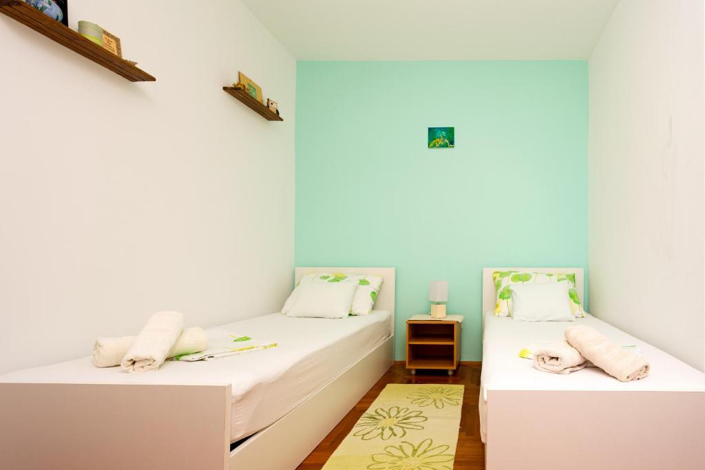 Postel nebo postele na pokoji v ubytování SeaView Guesthouse - ZF Hvar