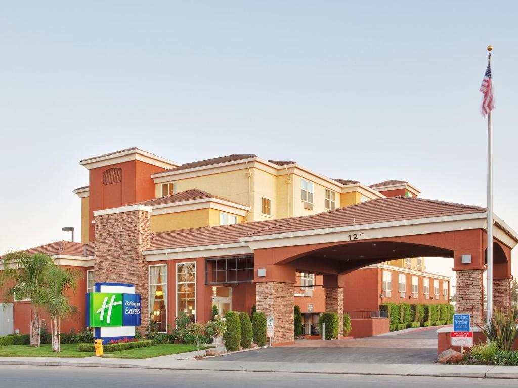 a hotel building with a sign in front of it at Holiday Inn Express- West Sacramento, an IHG Hotel in West Sacramento