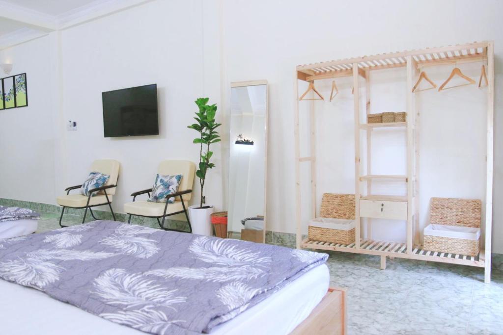 Giường trong phòng chung tại Xoài Xanh Hostel & Villa