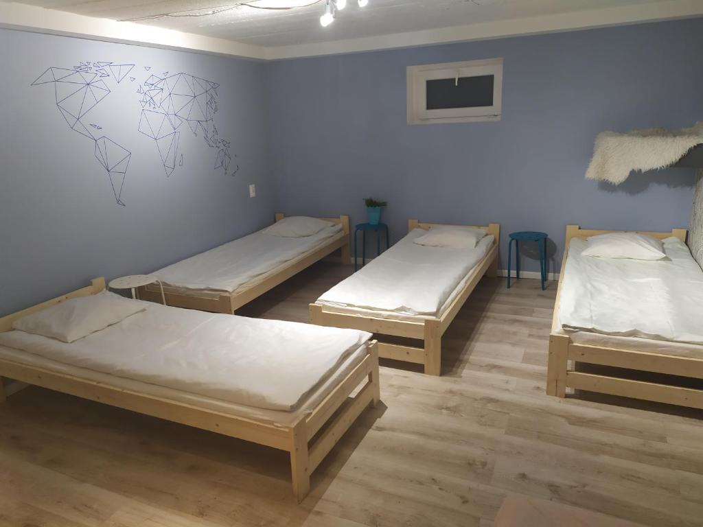 Postel nebo postele na pokoji v ubytování Olive Hostel