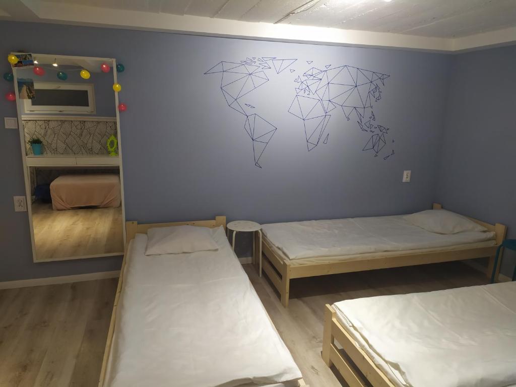 Postel nebo postele na pokoji v ubytování Olive Hostel