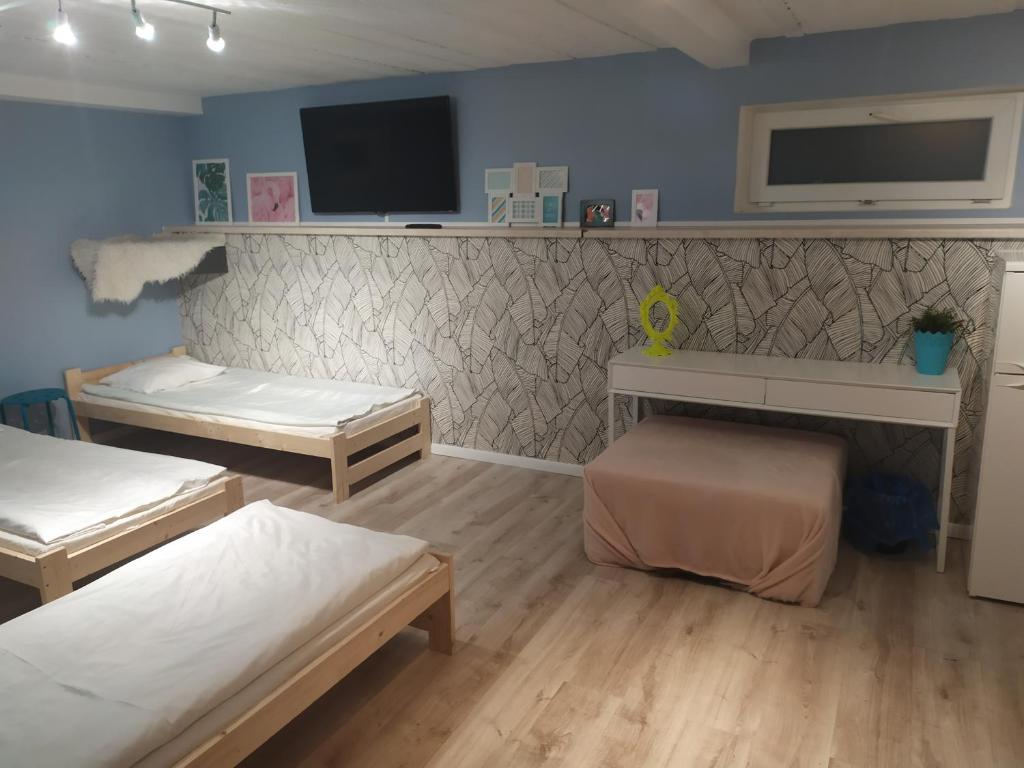 Postel nebo postele na pokoji v ubytování Olive Hostel