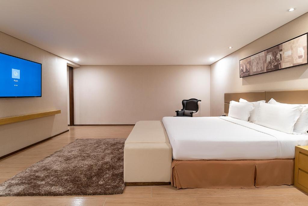 Postel nebo postele na pokoji v ubytování Jinjiang Inn - Makati