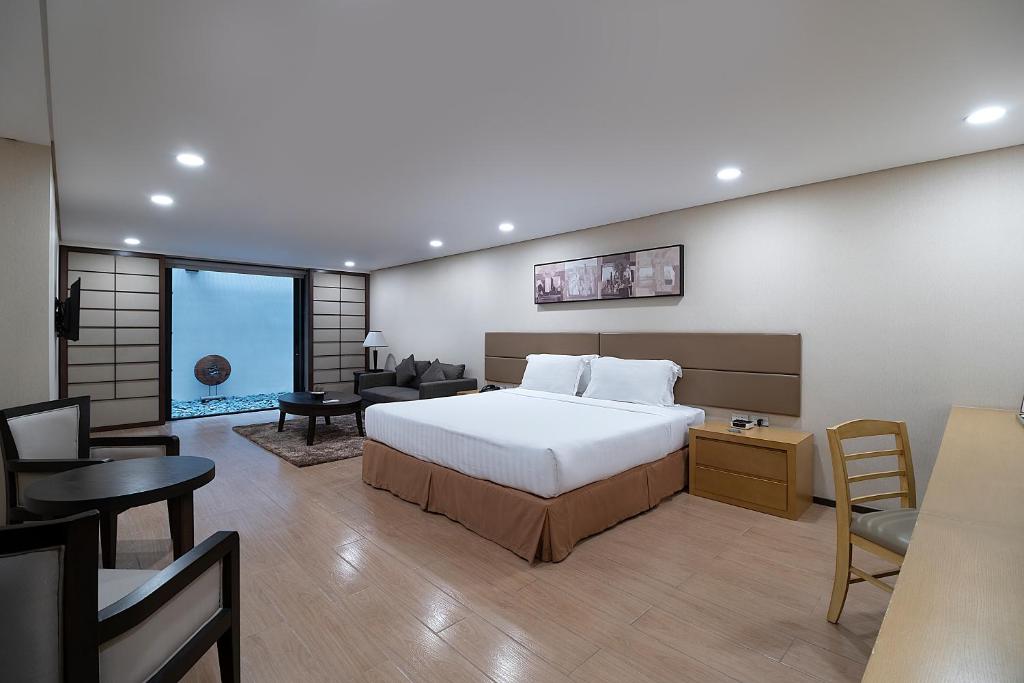 Postel nebo postele na pokoji v ubytování Jinjiang Inn - Makati
