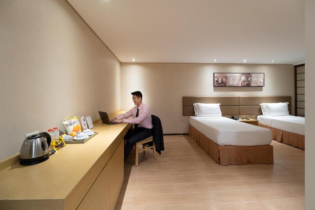 Postel nebo postele na pokoji v ubytování Jinjiang Inn - Makati