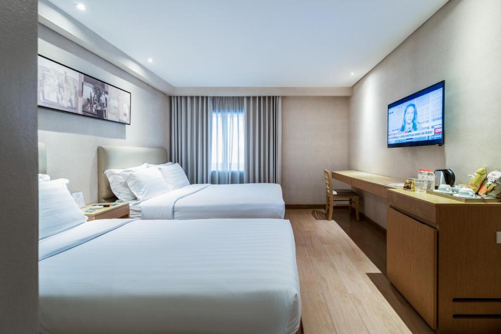Postel nebo postele na pokoji v ubytování Jinjiang Inn - Ortigas